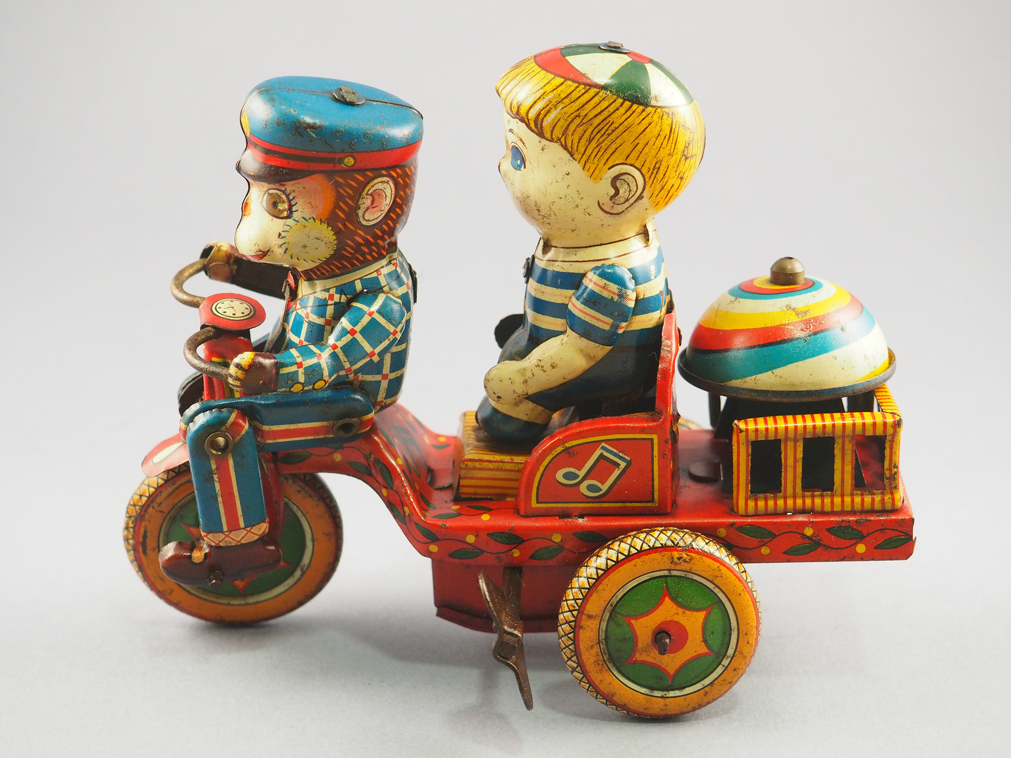 Monkey and boy on a tricycle photo 1