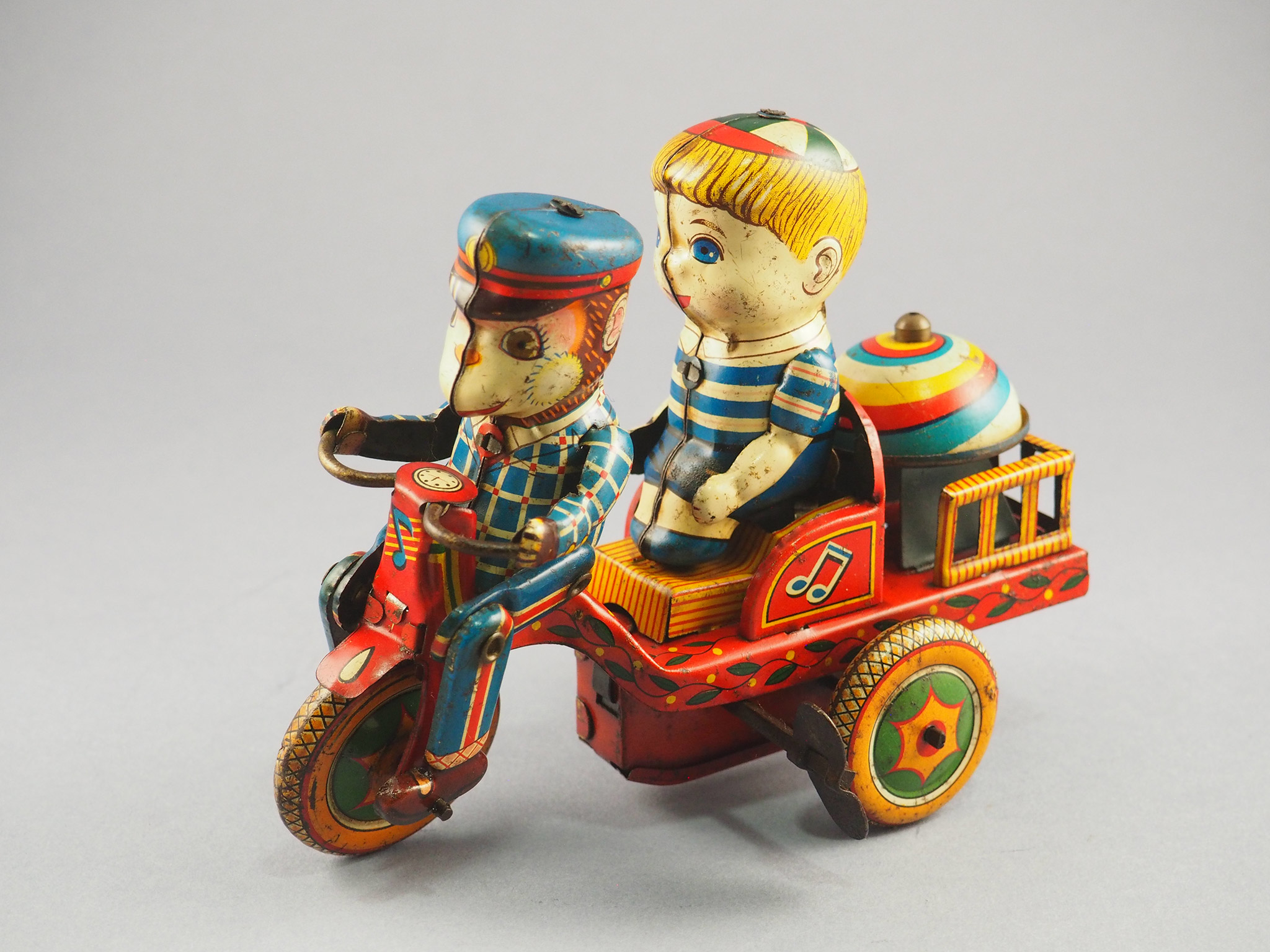 Monkey and boy on a tricycle photo 2